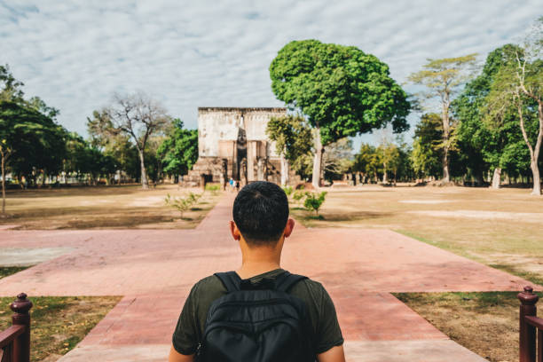 istock tourist visiting temple ruins in Thailand 1143486958