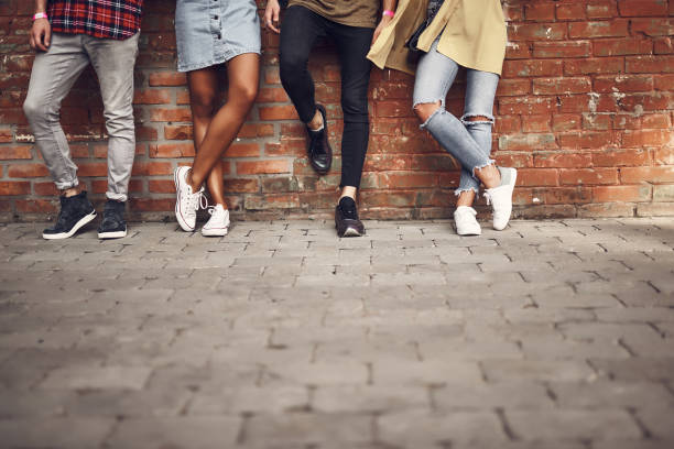 istock Four people wearing casual clothes while posing outdoors 1143487057