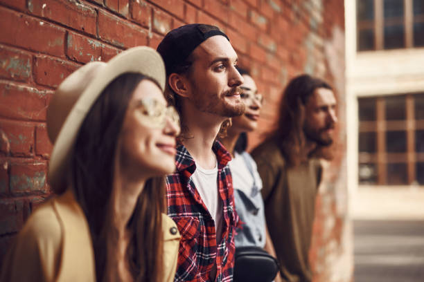 istock Relaxed people leaning on the wall and smiling peacefully 1143487070