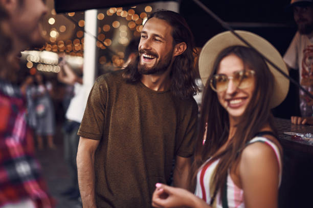 istock Beautiful couple relaxing outdoors and smiling happily 1143487108
