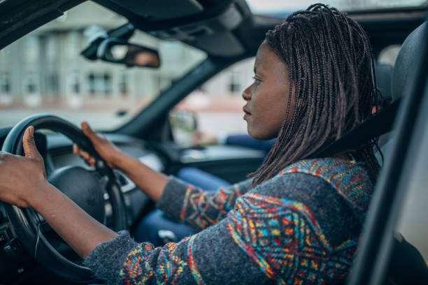 istock Black woman driving a car 1143488680