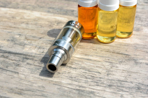 istock E - cigarette for vaping , technical devices.The liquid in the bottle 1143490234