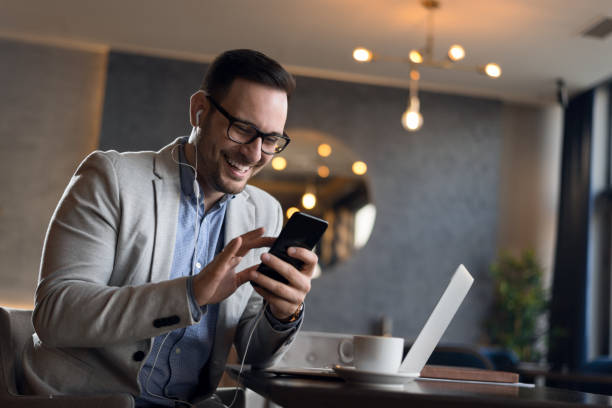 istock Businessman using mobile phone in cafe 1143491829