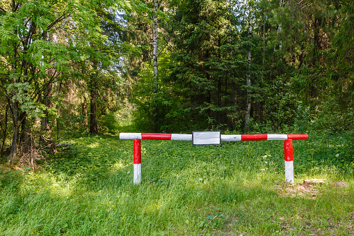 barrier on the forest road. The ban on entry into the forest.