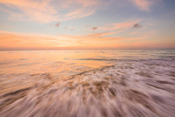 istock beach and sea in sunset 1143494695