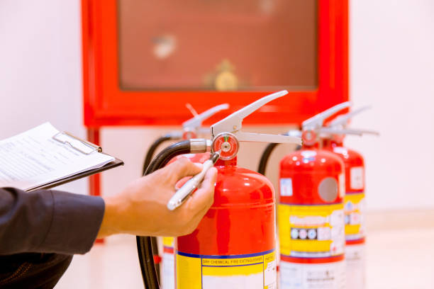 istock Male Professional inspection Fire extinguisher,safety concept. 1143494924