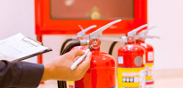 istock Male Professional inspection Fire extinguisher,safety concept. 1143495447