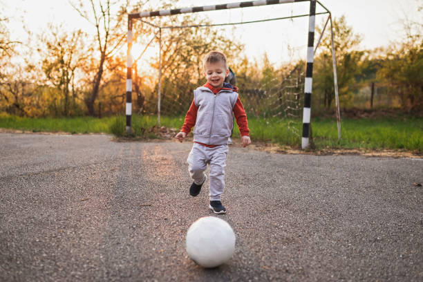 istock Little Boy Playing Soccer 1143495470