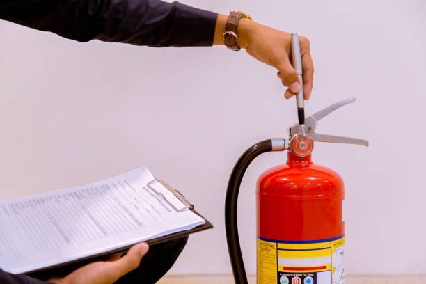 istock Male Professional inspection Fire extinguisher,safety concept. 1143495647