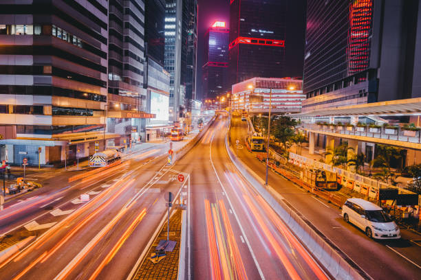 istock Light rail of car on road with skyscraper 1143495694