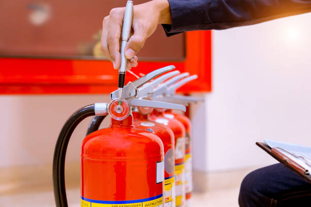 istock Male Professional inspection Fire extinguisher,safety concept. 1143495903