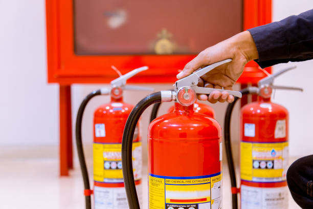 istock Male Professional inspection Fire extinguisher,safety concept. 1143496365