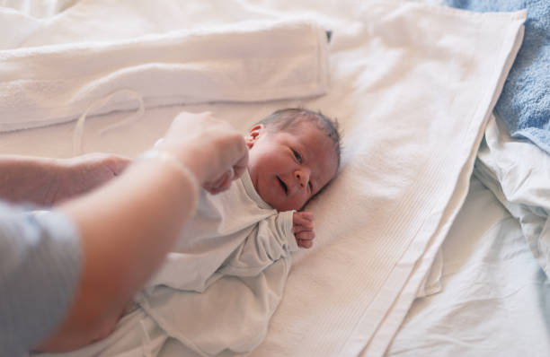 istock One day old baby changing diaper 1143497359