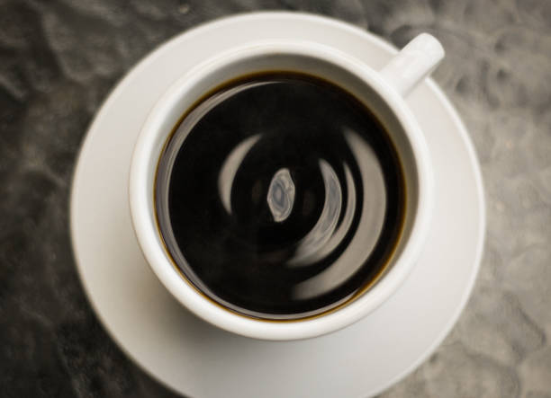 istock Top view from drip black coffee on a glass table 1143498035