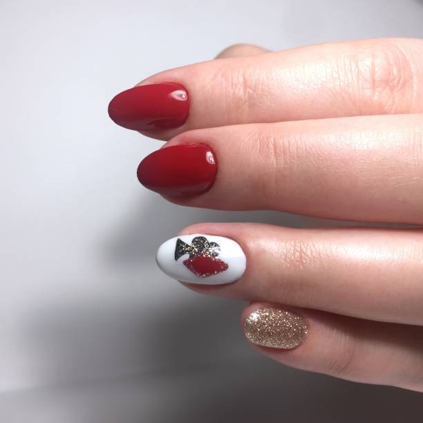 istock red female manicure on nails close up 1143500597
