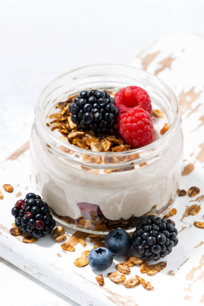 istock healthy creamy dessert with fresh berries in jar 1143501180