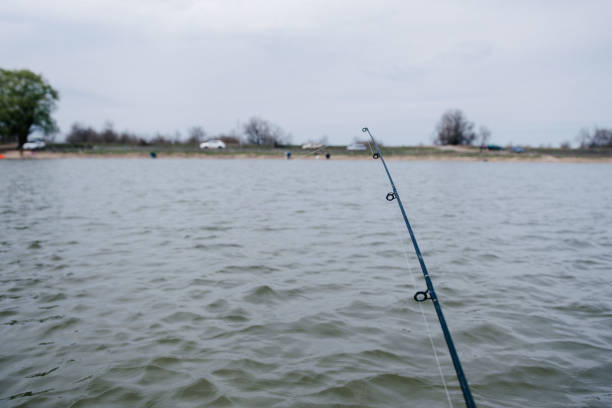istock Fishermen catch fish sitting in the boat 1143501994