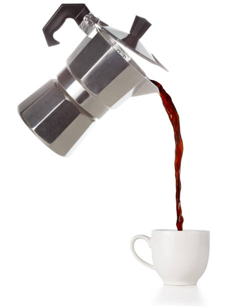 coffee flowing out of a flying moka coffee poured from a flying moka into a cup isolated on white pouring stock pictures, royalty-free photos & images