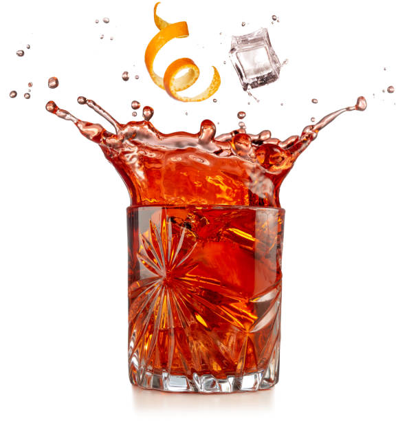 istock splashing negroni cocktail on white background 1143504913
