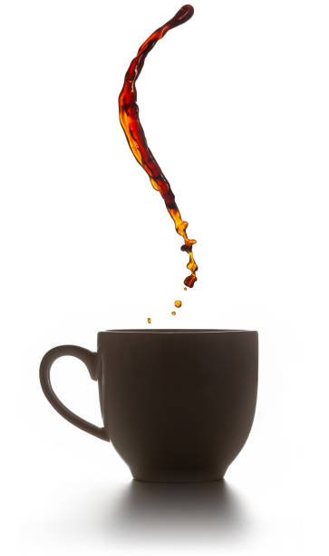 coffee flying splash over a cup stock photo