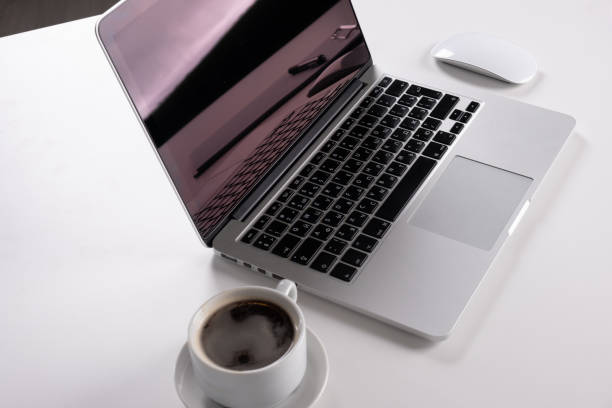 istock Laptop, notebook Tablet and cup of coffee on work desk 1143505137