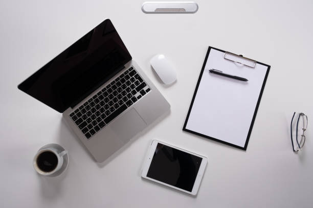 istock Laptop, notebook Tablet and cup of coffee on work desk 1143505181