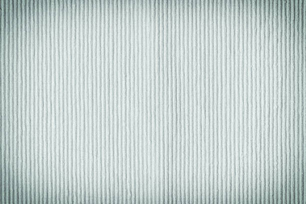 istock Dense fabric upholstery light blue. Texture of coarse fabric, close up. Blank background for layouts with vignette. 1143505265