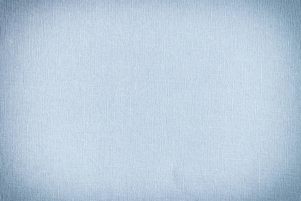 istock Thick blue paper with embossing. Blank background for layout with vignette. Paper texture close up. 1143505288