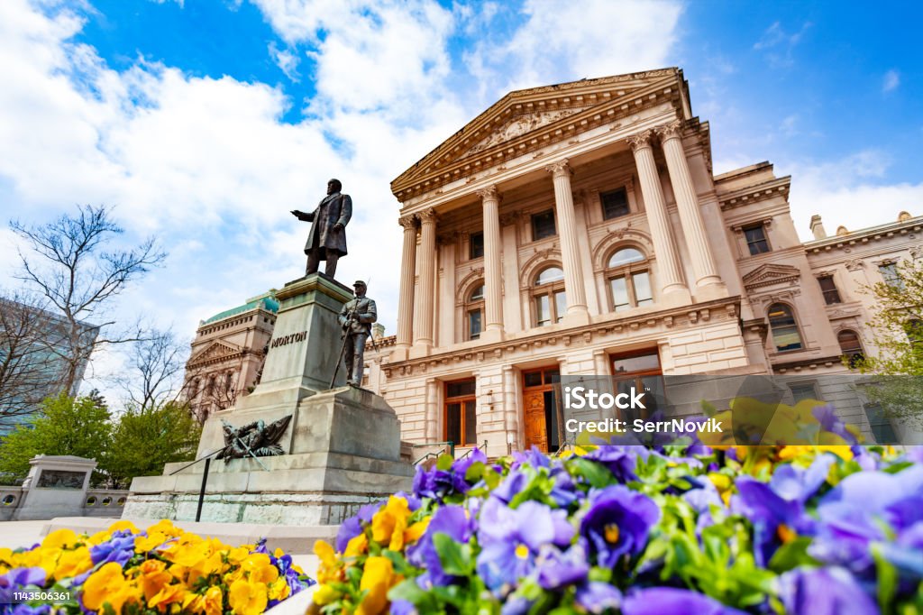 Morton statue in front of Indiana Statehouse, USA Oliver Perry Morton statue in front of the Indiana State Capitol building in springtime, Indianapolis, USA Indianapolis Stock Photo