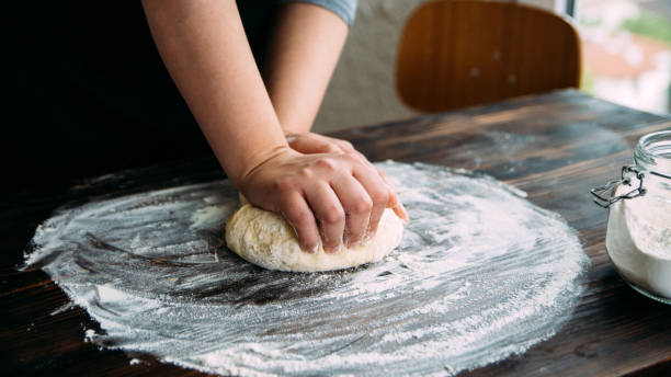 Woman kneading dough. Close Up Woman kneading dough. Close Up baking bread stock pictures, royalty-free photos & images