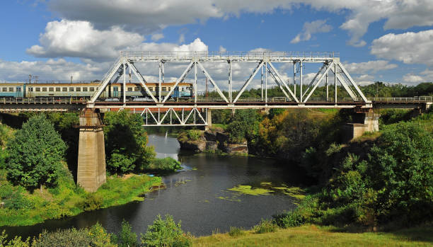 istock Railway bridge over the beautiful river, on which the train goes 1143509686