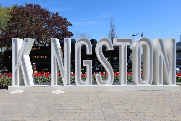Kingston City sign Kingston, Ontario, Canada - May 21, 2018: Kingston City sign across the street from the Kingston City Hall in Kingston, Ontario on a sunny day in May 2018 with red tulips behind it. Travelling in Ontario. victoria day canada photos stock pictures, royalty-free photos & images