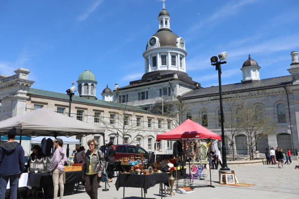 Kingston City Hall in Ontario Kingston, Ontario, Canada - May 21, 2018: Kingston City Hall taken from King St. and Springer Market Square with people in Kingston, Ontario in May 2018. Travelling in Canada victoria day canada photos stock pictures, royalty-free photos & images
