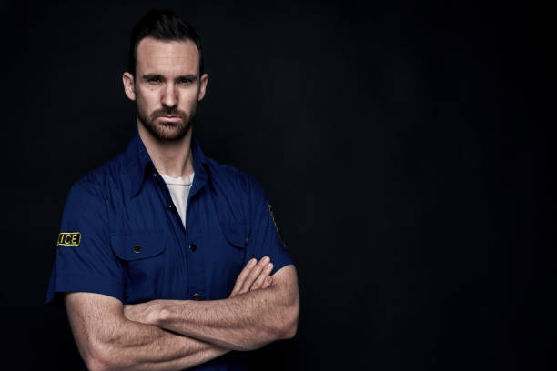 istock Handsome man wearing police uniform 1143511777