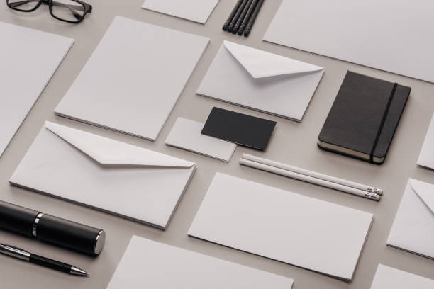 istock flat lay with white and black stationery on grey background 1143512580