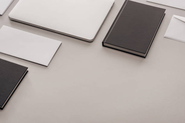istock black and white stationery and laptop on grey background 1143512585
