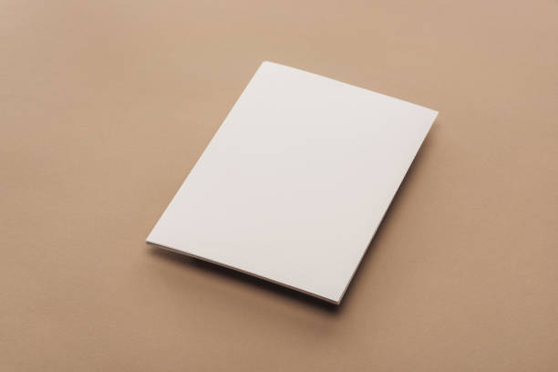 istock Empty sheet of paper with copy space on beige background 1143512618