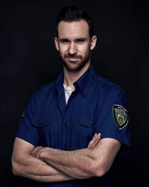 istock Handsome man wearing police uniform 1143512964