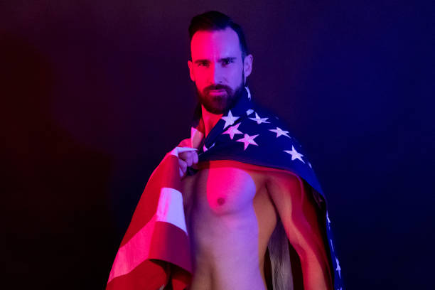 istock Handsome man holding an American flag 1143513615