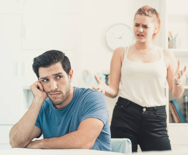 istock Frustrated guy at table with dissatisfied girlfriend 1143513647