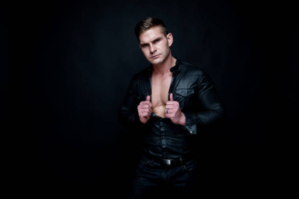istock Attractive muscular man wearing black 1143514532