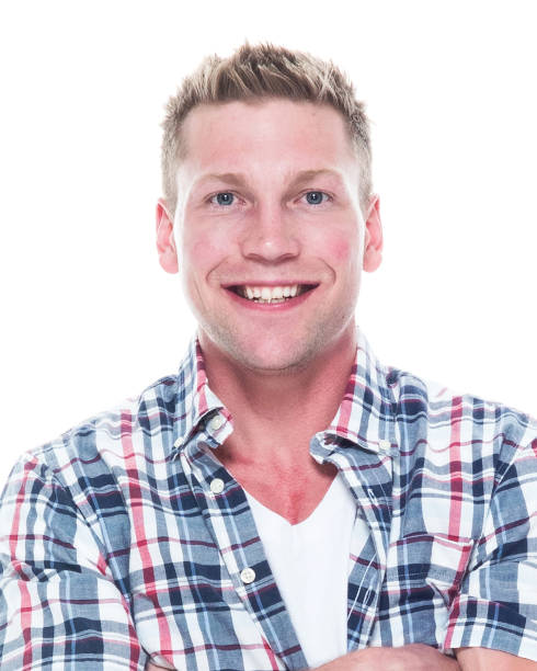 istock Handsome man in shirt and shorts with arms folded 1143514995
