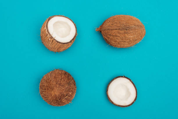 istock top view of whole coconuts and coconut halves on blue background 1143515211