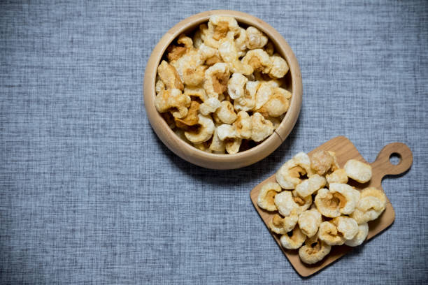istock Crispy deep fried pork skin or pork rind, appetizer in Thailand 1143516496