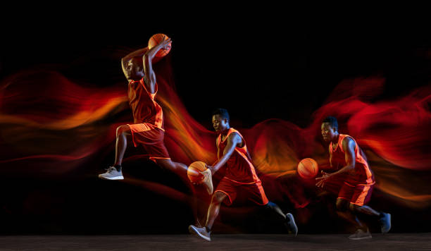 istock Young basketball player against dark background 1143517096