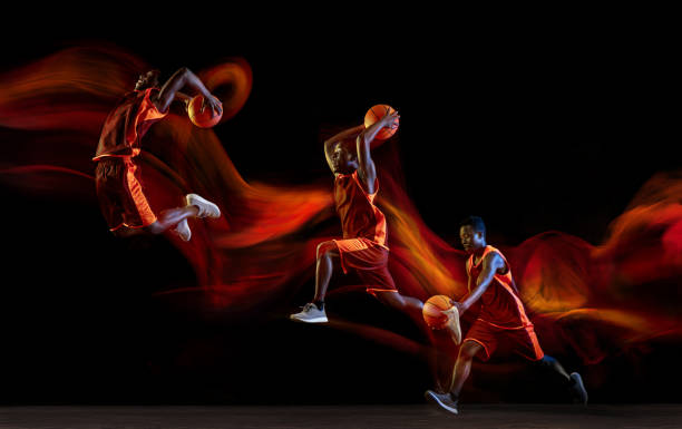 istock Young basketball player against dark background 1143517097