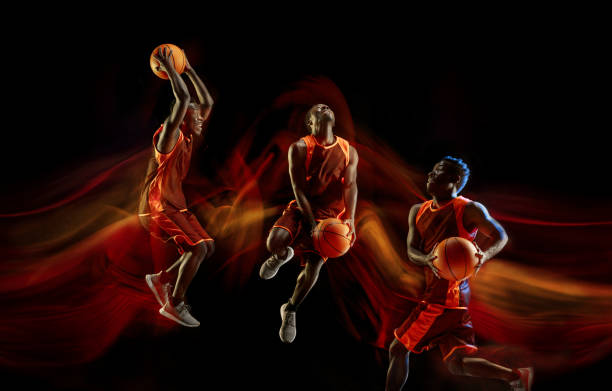 istock Young basketball player against dark background 1143517098