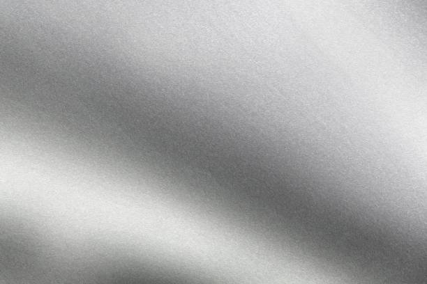 istock Abstract texture background, light shining on rough gray metal wall 1143518393