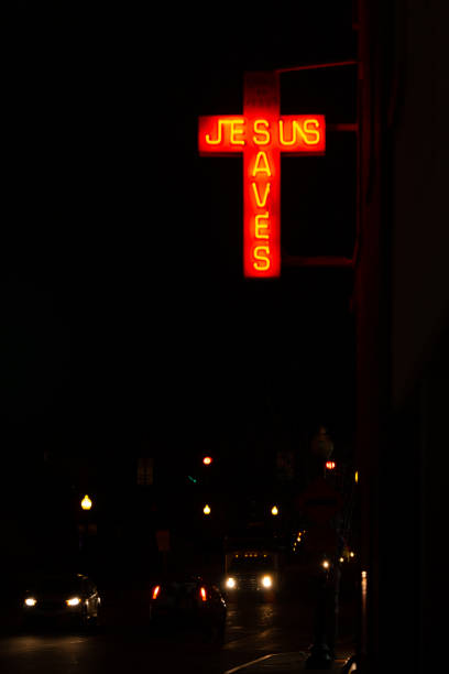 istock Jesus Saves Neon Cross Sign 1143519830