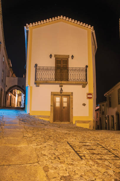 istock Old corner house in between two alleys at dusk in Marvao 1143520230